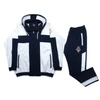Kép 1/9 - XL-6XL méretű FC.Fehér,sötétkék csíkos kapucnis nagyméretű férfi melegítő szett rugalmas pamut anyagból.Rendeljen online kényelmesen vagy jöjjön el hozzánk személyesen!